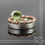 Peridot in Sterling Silver bezel ring with tri metal twist