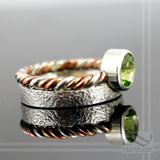 Peridot in Sterling Silver bezel ring with tri metal twist