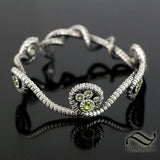 Coiled Serpent Bangle in Sterling Silver with Natural Peridot