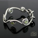 Coiled Serpent Bangle in Sterling Silver with Natural Peridot