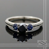 Black Diamond and Sapphire Three Stone Ring - 14k white gold