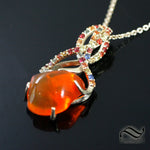 Carved Mexican Fire Opal in 14k with sapphires