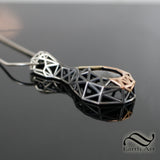 The Ember Pendant - Black Moissanite in 14k rose and yellow gold and Sterling Silver