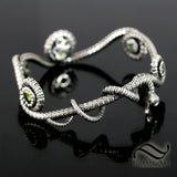 Coiled Serpent Bangle in Sterling Silver with Natural Peridot