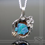 Boulder Opal Fish swimming in sterling Silver Cave