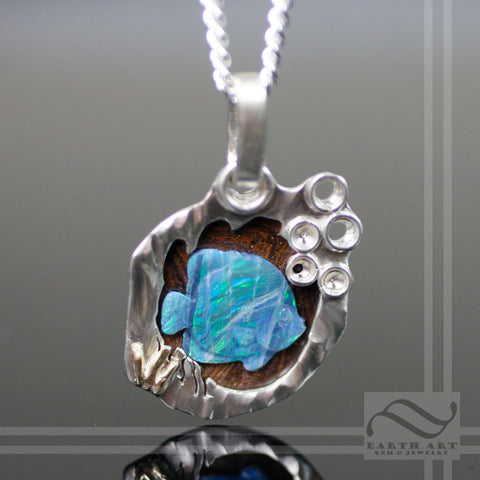 Boulder Opal Fish swimming in sterling Silver Cave